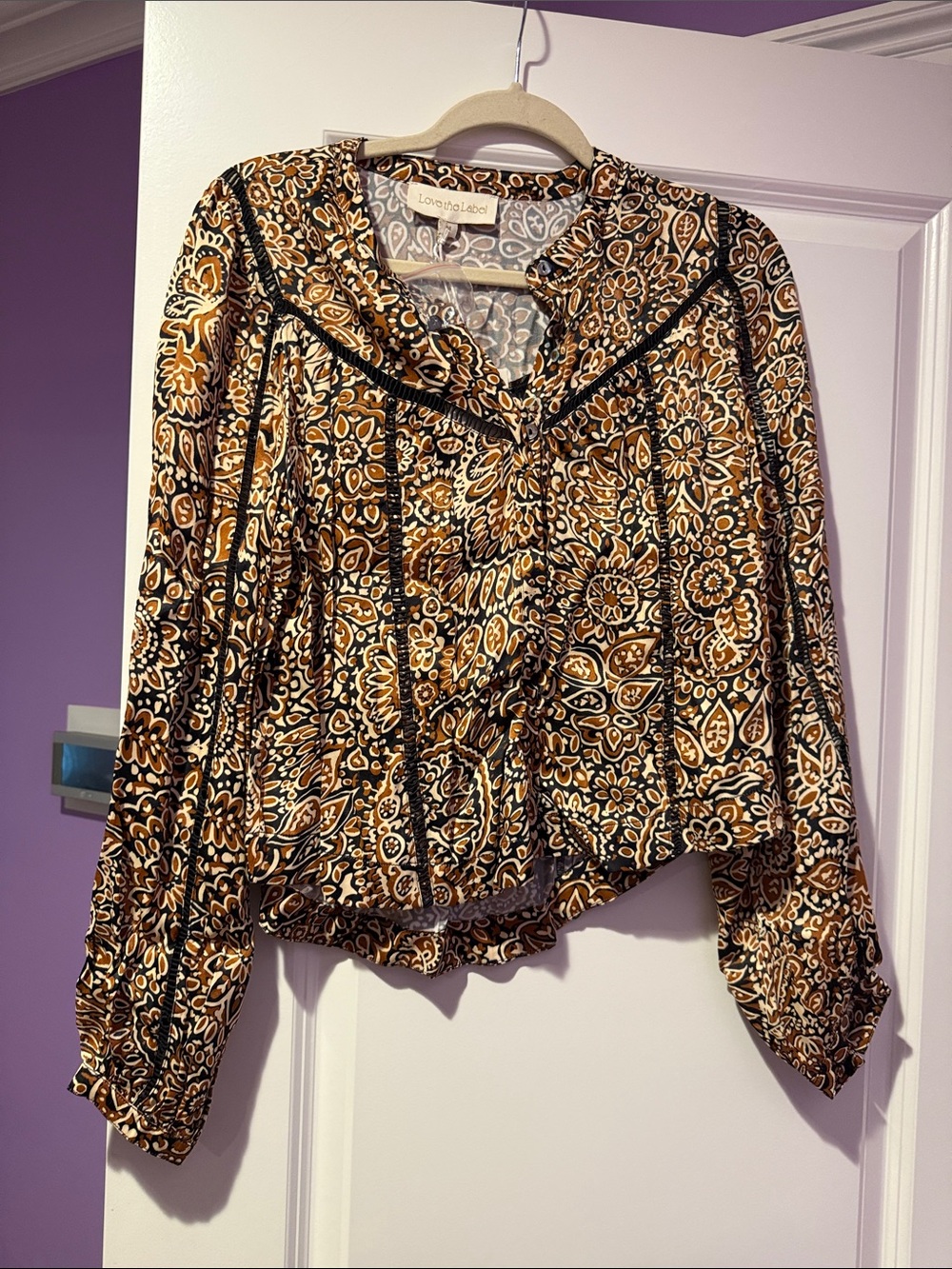 Love the label patterned blouse